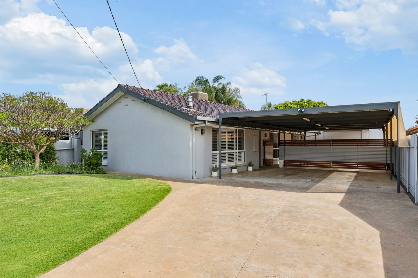 Front lawn, house and covered carport at McLaren Court