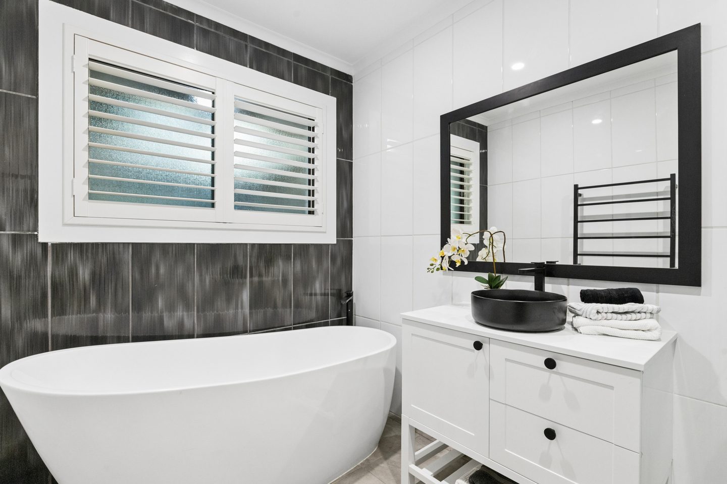 Bathroom with a freestanding bath and vanity
