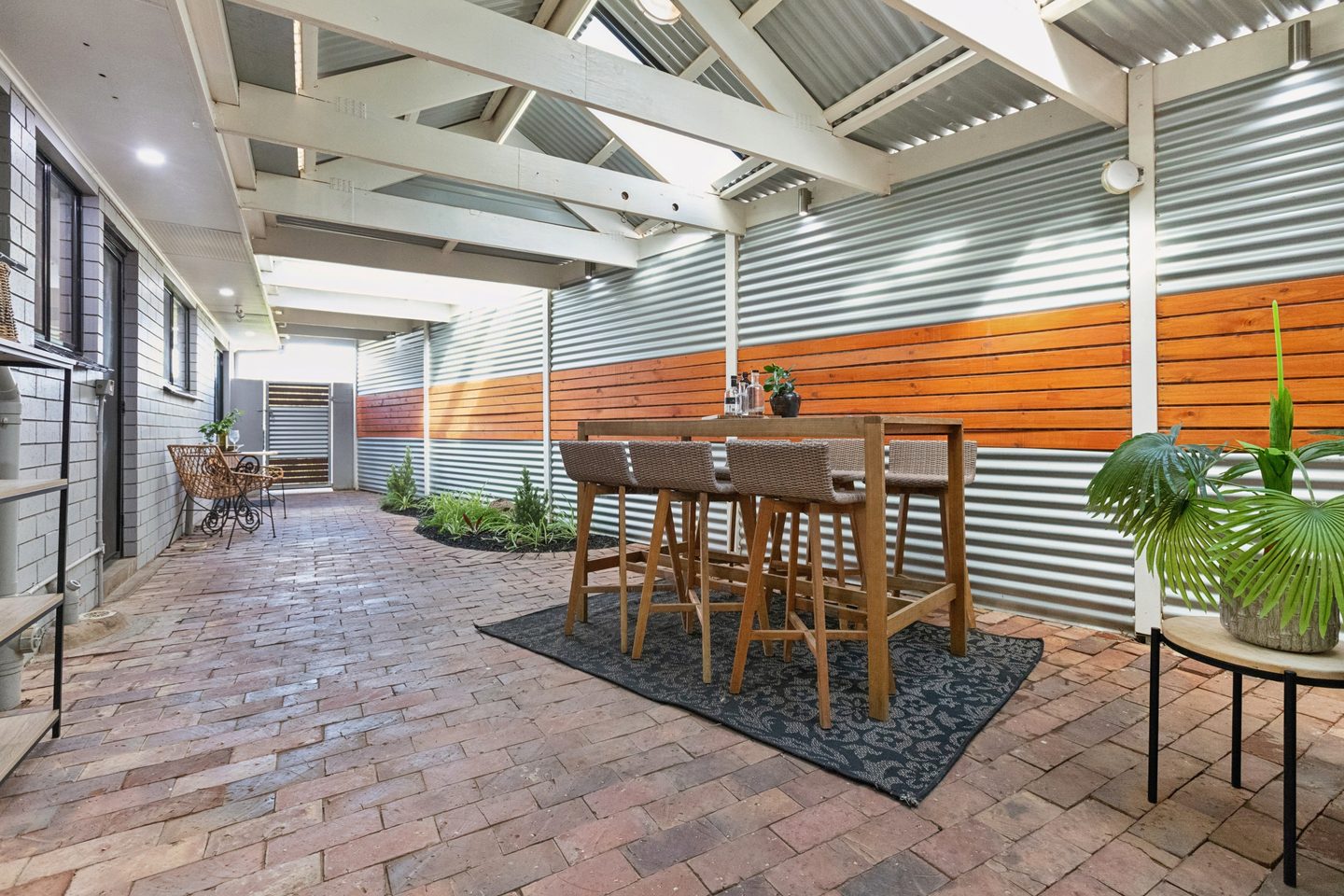 Covered patio with timber and metal screening
