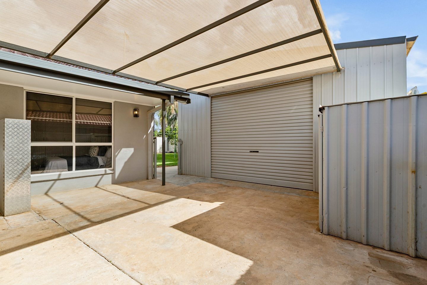 The shed roller door beside the house